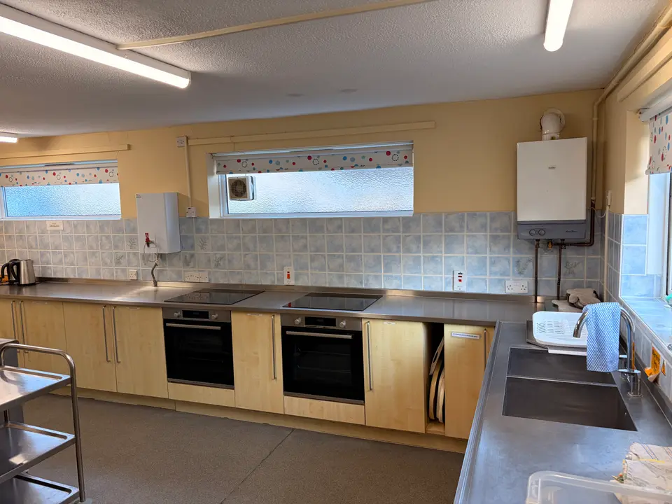 Kitchen with hobs, ovens and worktops